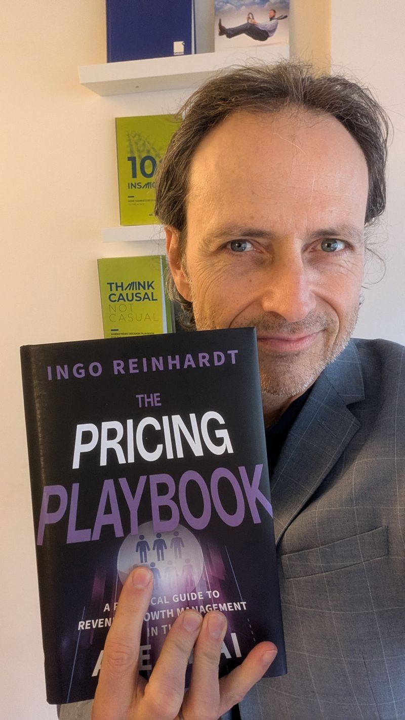 Dr. Frank Buckler with 'The Pricing Playbook' by Ingo Reinhardt