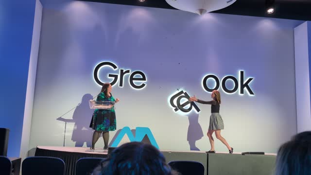 On stage at IIEX NA 2026 — the conference moment behind the faster-easier-cheaper critique (video still)